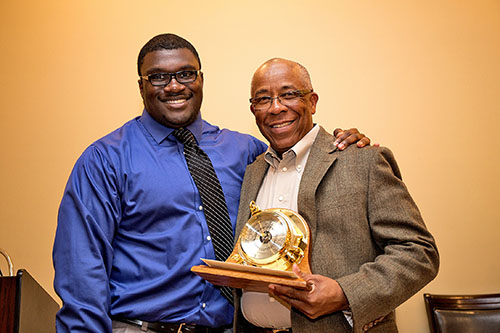 Richard Benjamin of ExxonMobil presents the 2015 ExxonMobil Academic Award to Jesse Kelley.