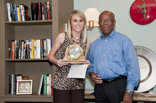 Meghan Mee accepts the 2010 ExxonMobil Academic Award as the outstanding meteorology senior from Richard Benjamin of ExxonMobil.