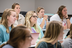 A group of students listening in class.