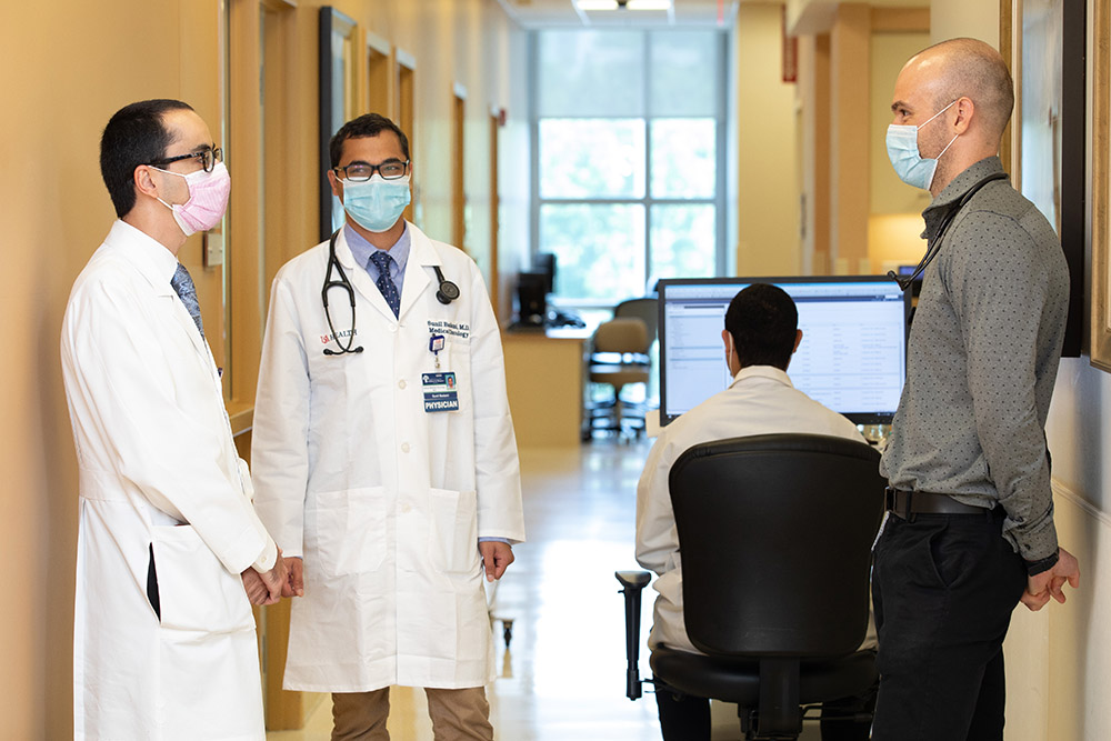 Medical Oncology fellows meeting in a hallway