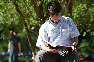 Student studying outside.