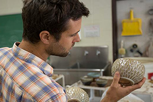 Student working in ceramics.