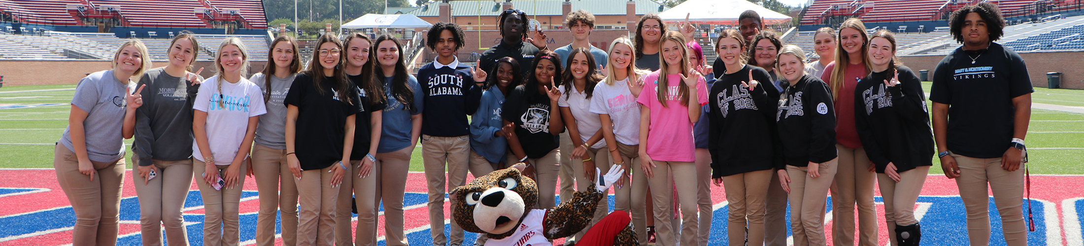 Start South students with Southpaw on the football field.