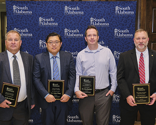 USANAA winners holding their plaques.