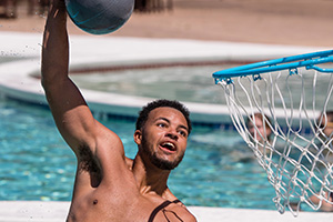 Student playing water basketball.