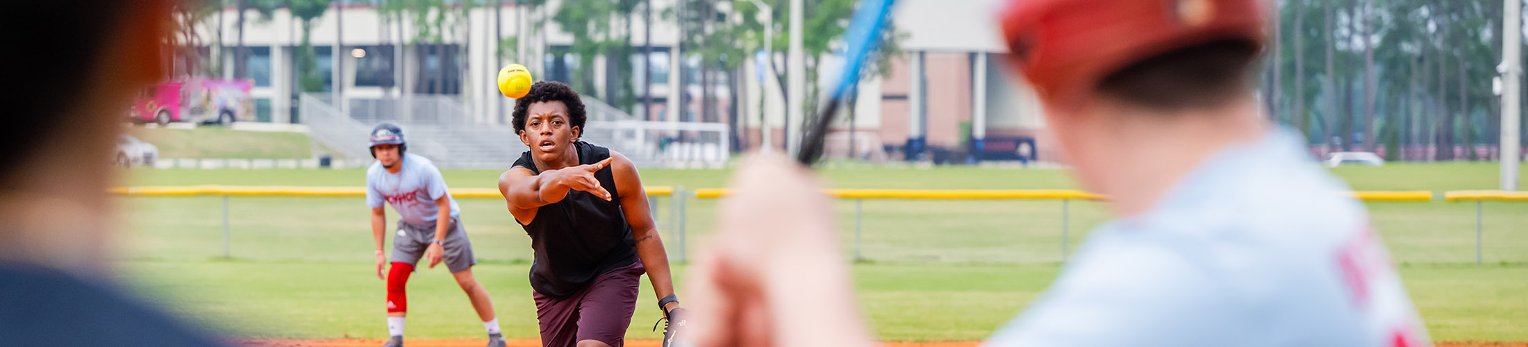 Students playing softball.