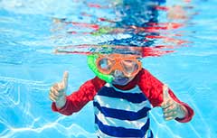 Instructor teaching swim lessons in the pool