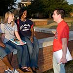 Students sitting at Moulton Tower talking