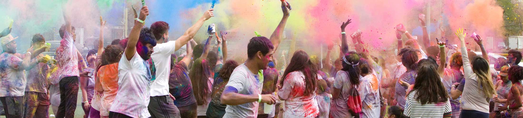 Students throwing color in event