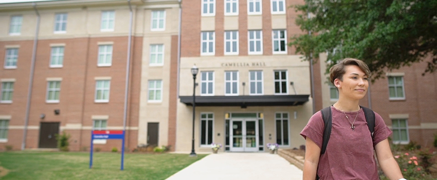 Lexe walking away from Camellia Hall