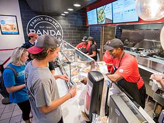 Students ordering lunch at food court