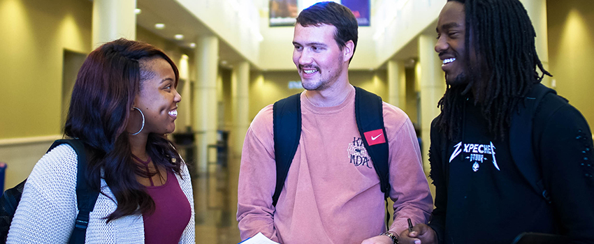 Three students talking 