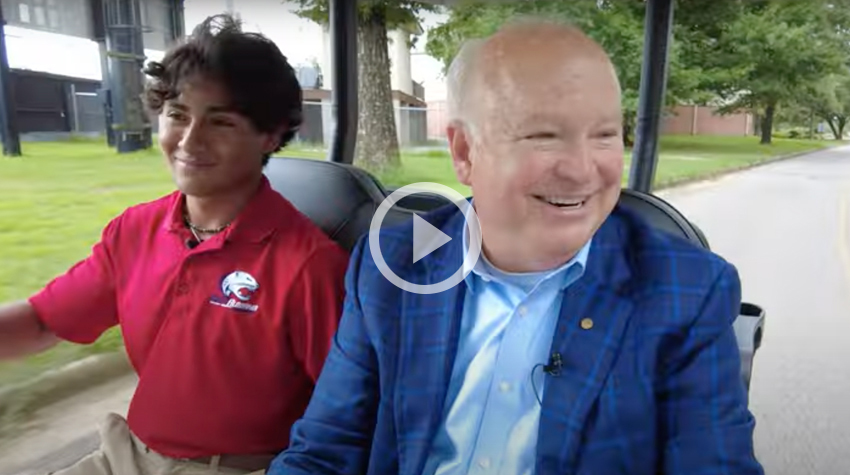 President Bonner with Julian in the Golf Cart.