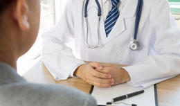 Doctor and patient at desk