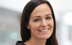 Woman with brown hair smiling